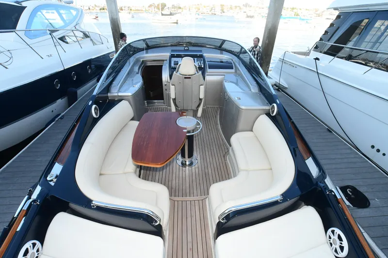 Slide: The Image of Luxurious 2012 Riva Rivarama yacht with elegant seating and wooden table on deck. - 14