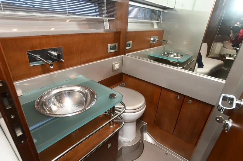 Slide: The Image of Luxurious 2012 Riva Rivarama yacht bathroom with modern fixtures and elegant wood finish. - 24