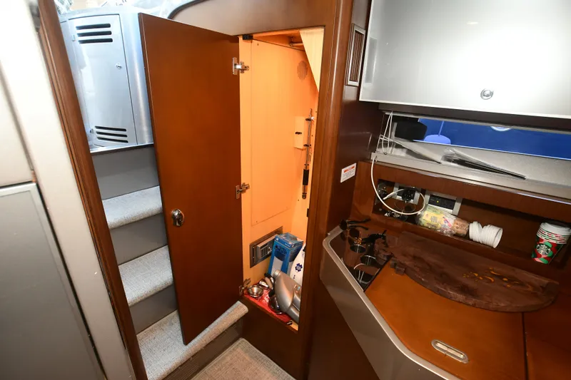 Slide: The Image of Interior of a 2012 Riva Rivarama yacht showing a cabin with stairs and storage area. - 30