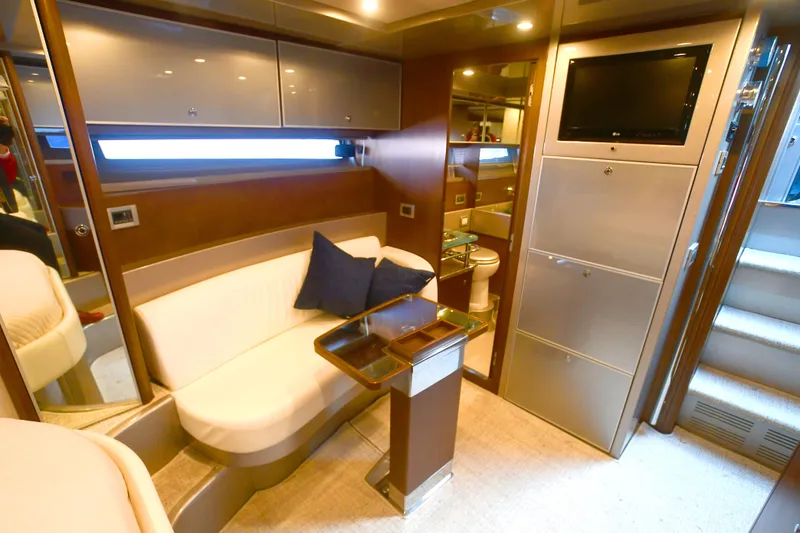 Slide: The Image of Luxurious 2012 Riva Rivarama yacht interior with modern seating, TV, and elegant wood finishes. - 36