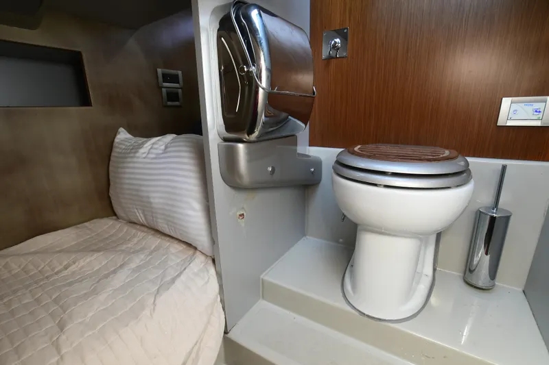 Slide: The Image of 2012 Riva Rivarama yacht interior with bed and modern bathroom amenities. - 41