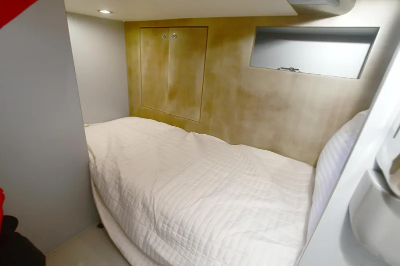 Slide: The Image of Cozy cabin interior of 2012 Riva Rivarama yacht with white bedding. - 42