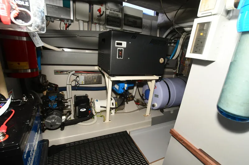 Slide: The Image of Engine room of a 2012 Riva Rivarama yacht, showcasing equipment and machinery. - 44