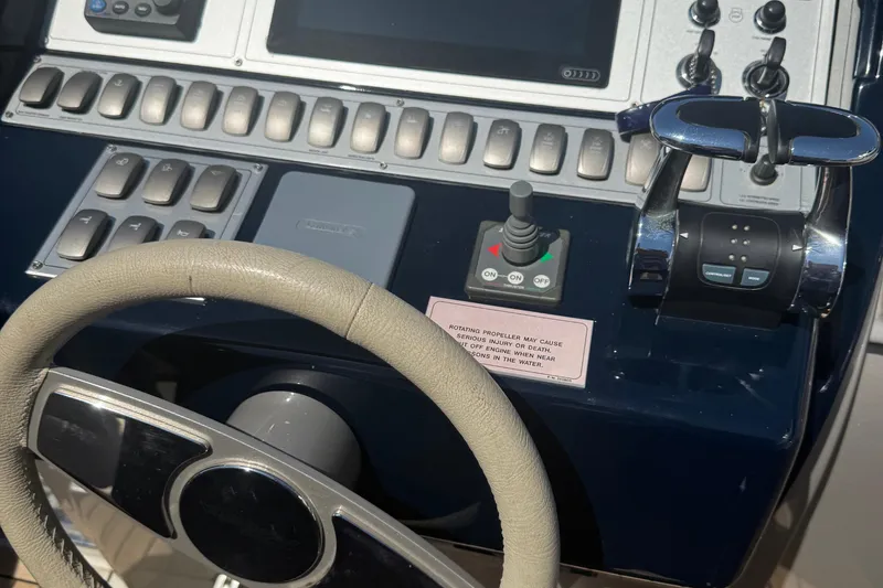 Slide: The Image of Steering wheel and controls of a 2012 Riva Rivarama yacht cockpit. - 45