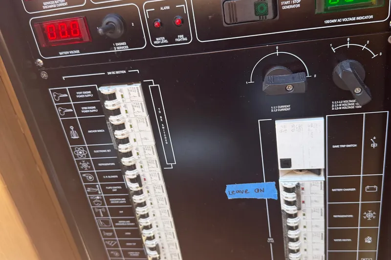 Slide: The Image of Control panel of a 2012 Riva Rivarama yacht with labeled switches and indicators. - 47