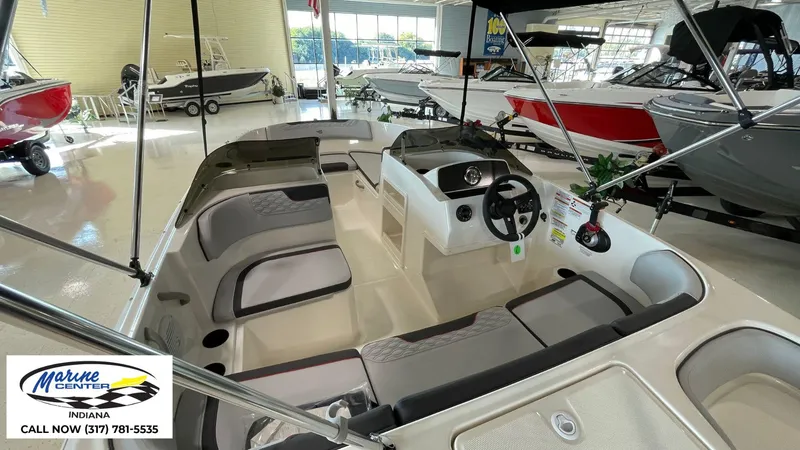 Slide: The Image of 2024 Bayliner M17 boat interior at Marine Center Indiana showroom. - 13
