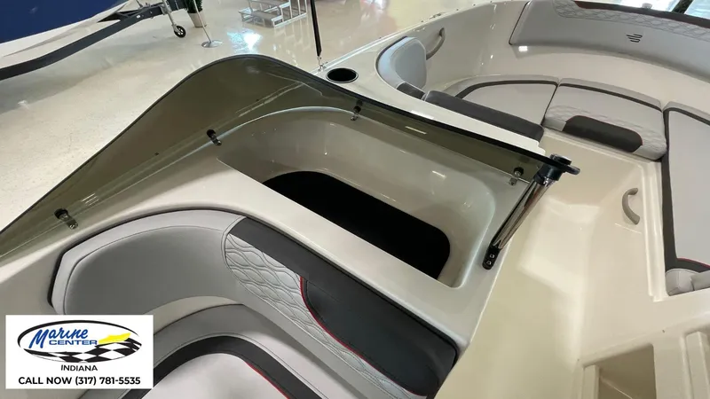 Slide: The Image of 2024 Bayliner M17 boat interior with seating and storage, displayed at Marine Center Indiana. - 6