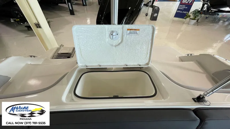 Slide: The Image of 2024 Bayliner M17 boat storage compartment open at Marine Center Indiana showroom. - 8