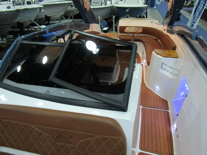 Slide: The Image of 2025 NX Boats N280 XTREME interior with luxurious seating and modern design features. - 15