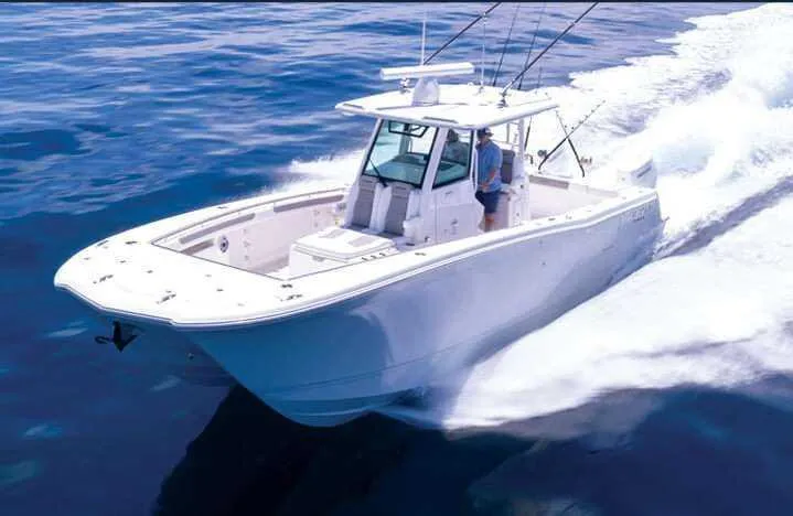 Slide: The Image of 2025 Caymas 34 CT boat cruising on open water, showcasing sleek design and performance. - 0