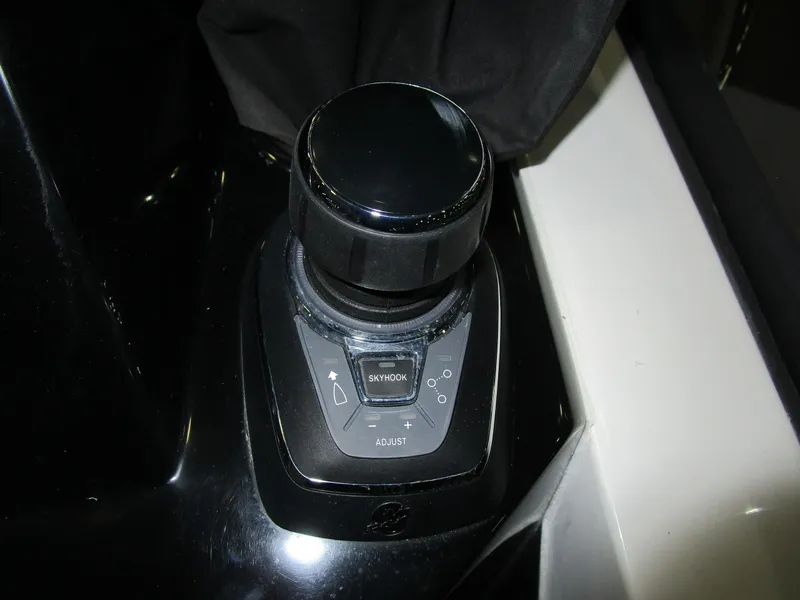 Slide: The Image of Control knob on 2025 NX Boats 340 Sport Coupe dashboard. - 17