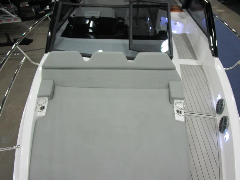 Slide: The Image of 2025 NX Boats 340 Sport Coupe interior with spacious seating and sleek design. - 19