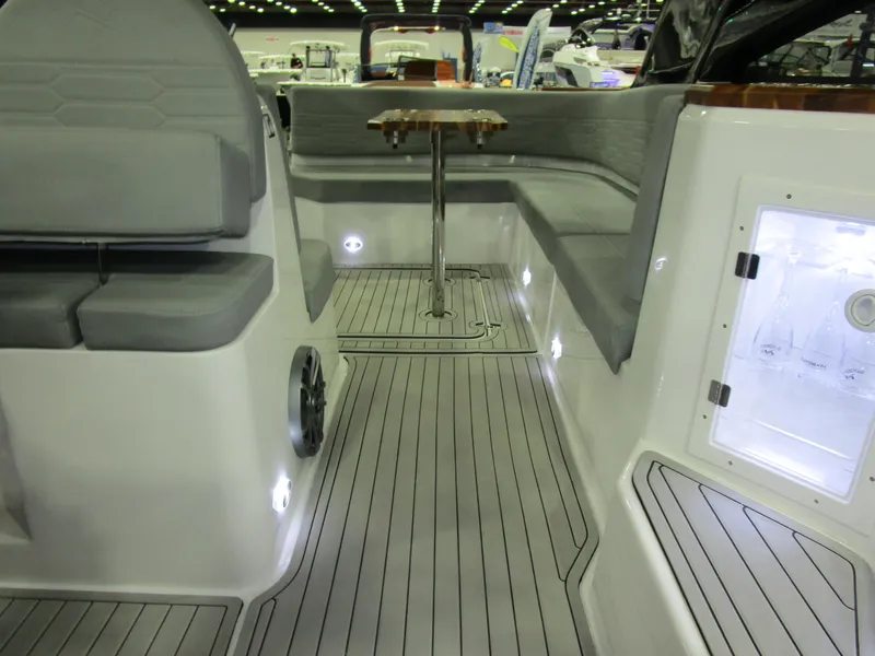 Slide: The Image of 2025 NX Boats 340 Sport Coupe interior with sleek seating and modern design. - 31