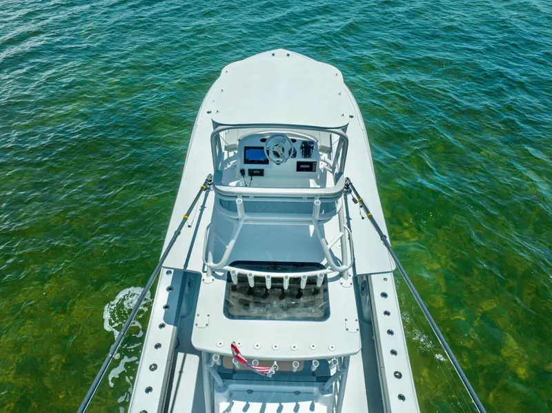 Slide: The Image of 2023 Yellowfin 42 Offshore boat on clear water, aerial view. - 13