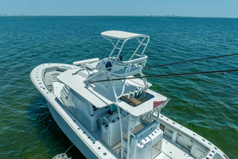 Slide: The Image of 2023 Yellowfin 42 Offshore boat on open water, featuring a sleek design and spacious deck. - 15