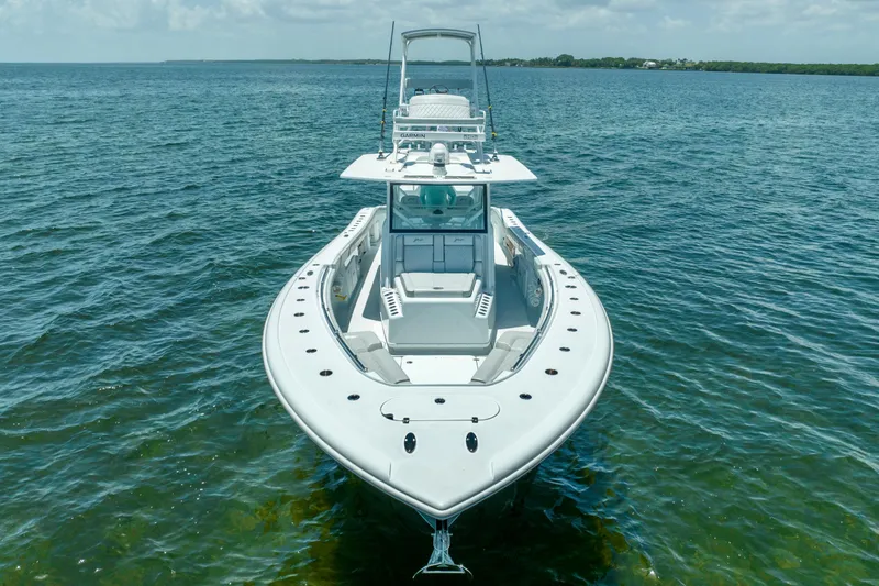 Slide: The Image of 2023 Yellowfin 42 Offshore boat on calm water, front view. - 16