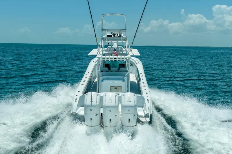 Slide: The Image of 2023 Yellowfin 42 Offshore boat cruising on open ocean waters. - 17
