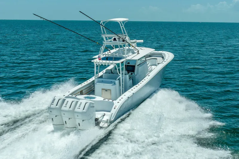 Slide: The Image of 2023 Yellowfin 42 Offshore boat cruising on open ocean waters. - 19