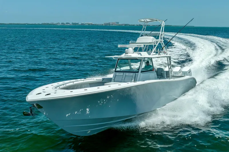 Slide: The Image of 2023 Yellowfin 42 Offshore boat cruising on open water, showcasing sleek design and performance. - 23