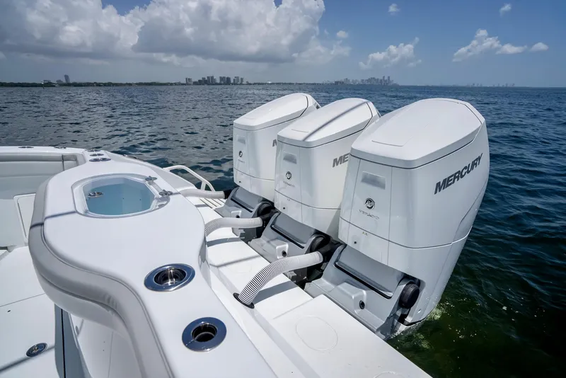 Slide: The Image of 2023 Yellowfin 42 Offshore boat with triple Mercury outboard engines on open water. - 40