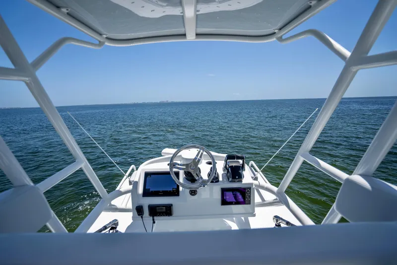 Slide: The Image of 2023 Yellowfin 42 Offshore boat dashboard with ocean view. - 48