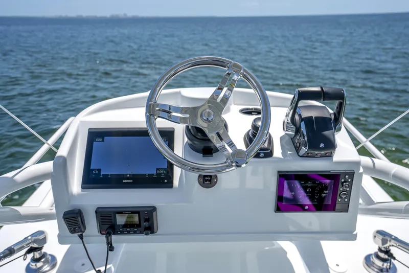 Slide: The Image of Helm of 2023 Yellowfin 42 Offshore boat with modern navigation equipment. - 49