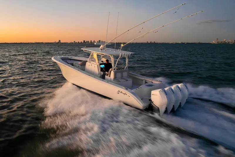 Slide: The Image of 2016 Yellowfin 39 Offshore boat cruising at sunset on open water. - 10