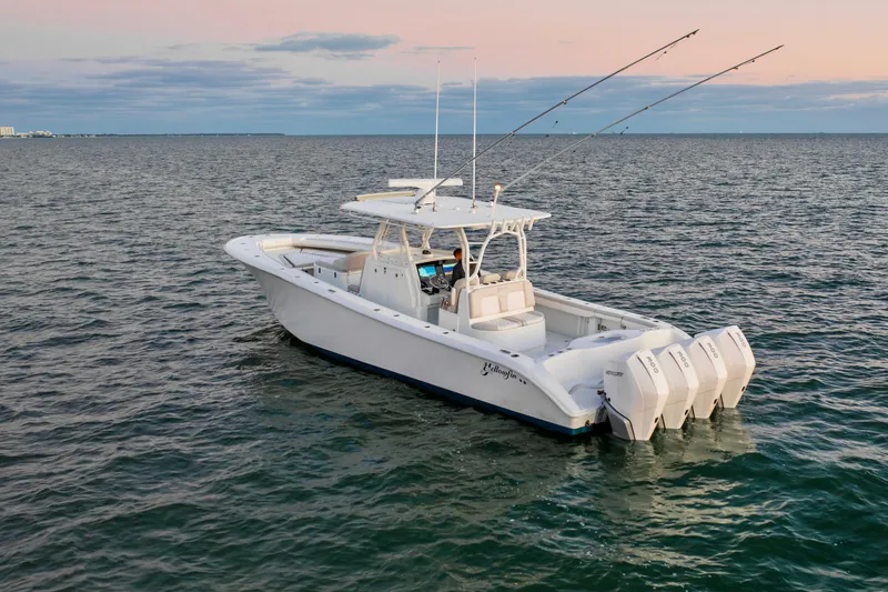 Slide: The Image of 2016 Yellowfin 39 Offshore boat on calm ocean at sunset. - 16