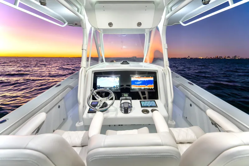Slide: The Image of 2016 Yellowfin 39 Offshore boat interior with sunset ocean view. - 18