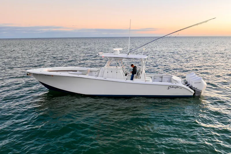 Slide: The Image of 2016 Yellowfin 39 Offshore boat on calm sea at sunset. - 2