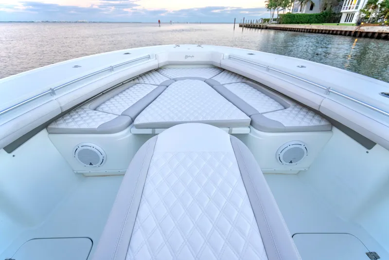 Slide: The Image of 2016 Yellowfin 39 Offshore boat with luxurious seating and waterfront view. - 24