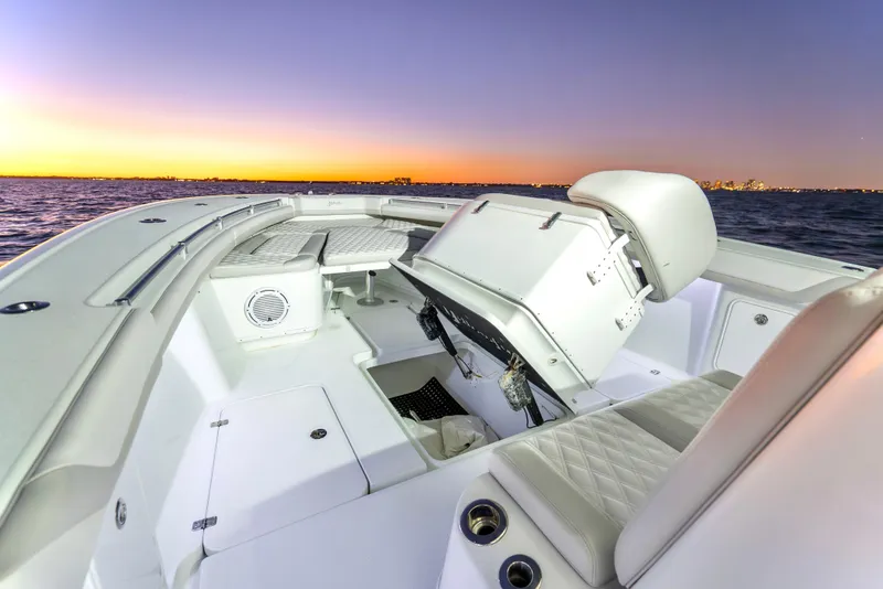 Slide: The Image of 2016 Yellowfin 39 Offshore boat interior at sunset on the water. - 28