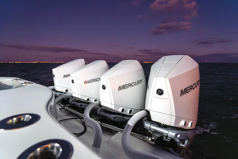 Slide: The Image of 2016 Yellowfin 39 Offshore boat with four Mercury outboard engines at sunset. - 32
