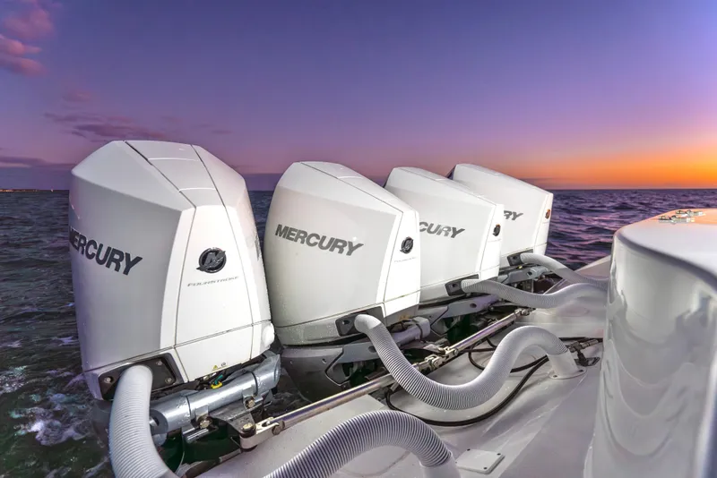 Slide: The Image of 2016 Yellowfin 39 Offshore boat with four Mercury outboard engines at sunset. - 33