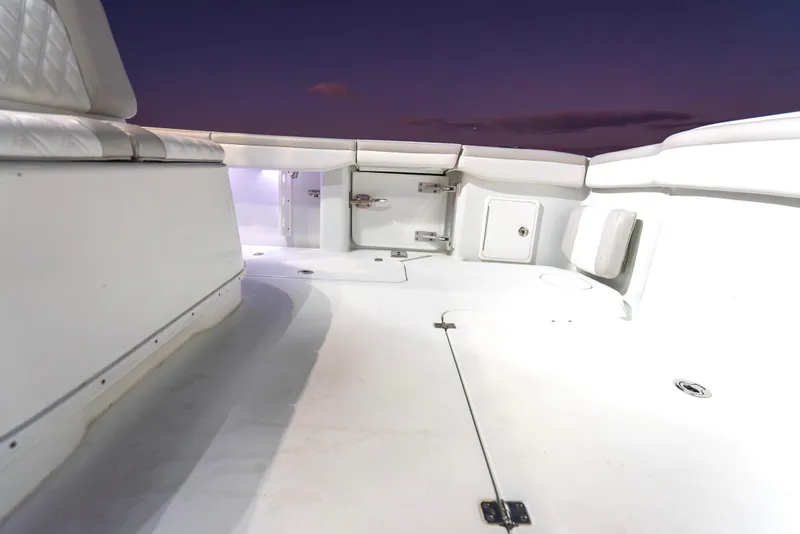 Slide: The Image of 2016 Yellowfin 39 Offshore boat deck at sunset, featuring spacious seating and storage. - 34