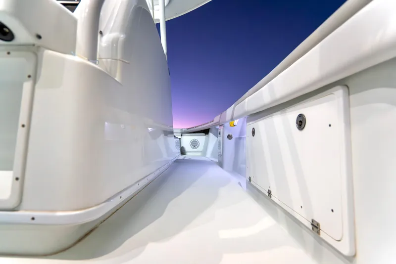 Slide: The Image of 2016 Yellowfin 39 Offshore boat interior at sunset, showcasing sleek white design. - 35