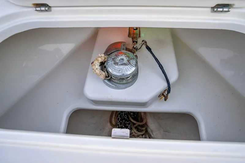 Slide: The Image of Anchor compartment of 2016 Yellowfin 39 Offshore boat with winch and chain. - 39