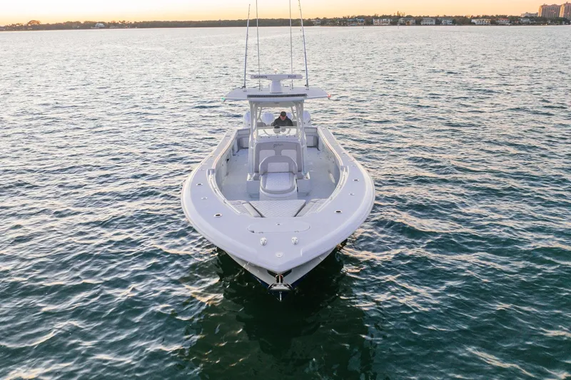 Slide: The Image of 2016 Yellowfin 39 Offshore boat on calm water at sunset. - 4
