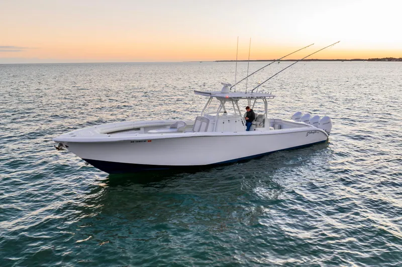Slide: The Image of 2016 Yellowfin 39 Offshore boat on calm sea at sunset. - 5