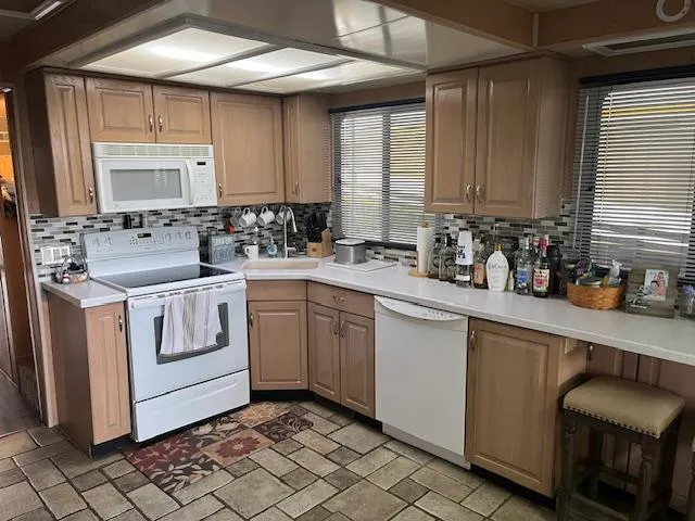 Slide: The Image of 1988 Stardust Cruisers houseboat kitchen with modern appliances and wooden cabinetry. - 6