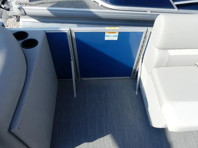 Slide: The Image of Interior of 2025 Godfrey Pontoons Xperience 1886 CX, featuring seating and cup holders. - 12