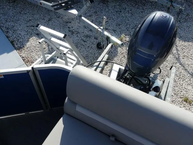 Slide: The Image of 2025 Godfrey Pontoons Xperience 1886 CX with outboard motor and trailer. - 14