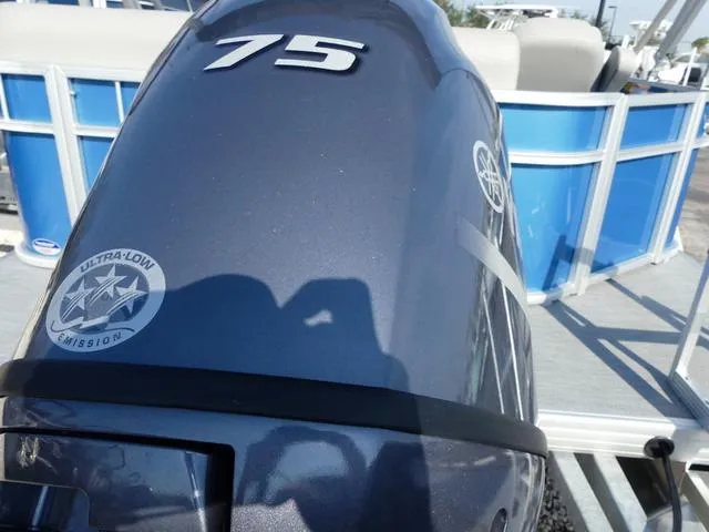 Slide: The Image of Outboard motor on 2025 Godfrey Pontoons Xperience 1886 CX, featuring ultra-low emission technology. - 5