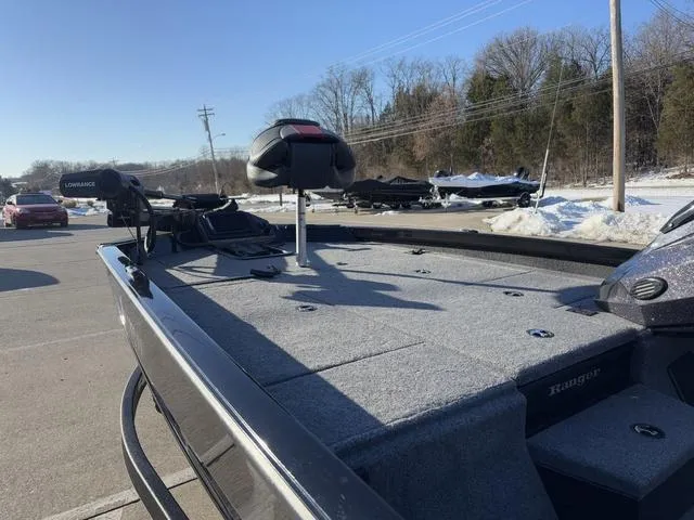 Slide: The Image of 2023 Ranger RT188 fishing boat with spacious deck and seating in a snowy outdoor setting. - 10