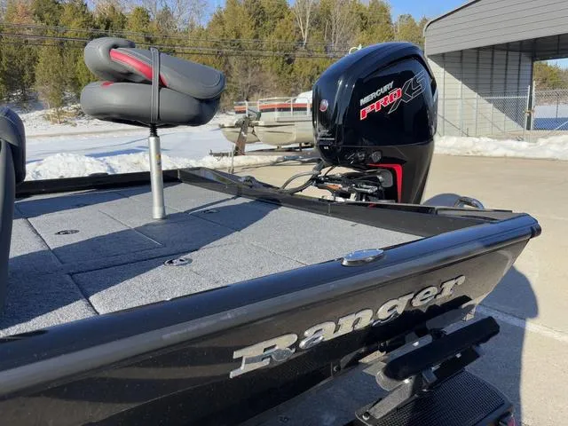 Slide: The Image of 2023 Ranger RT188 boat with Mercury Pro XS engine, parked outdoors. - 11