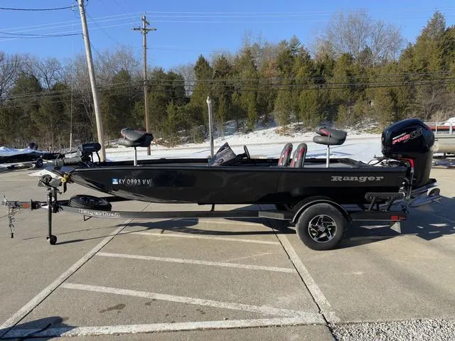 Slide: The Image of 2023 Ranger RT188 boat in parking lot, black exterior, trailer attached, winter setting. - 12