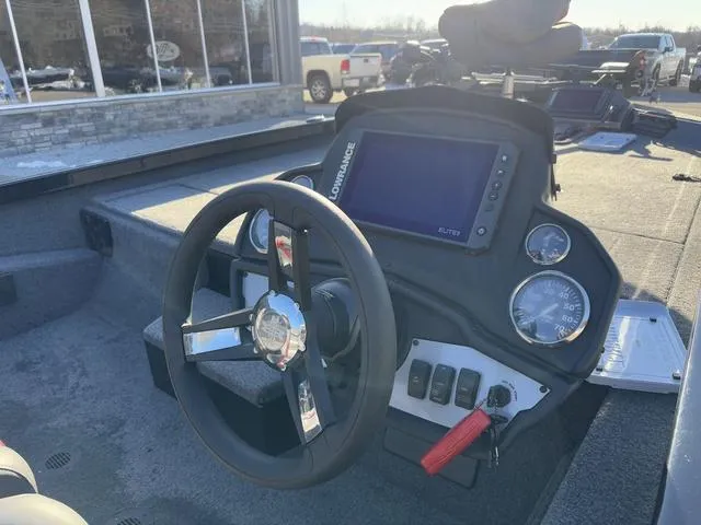 Slide: The Image of 2023 Ranger RT188 boat dashboard with steering wheel and electronic display. - 4