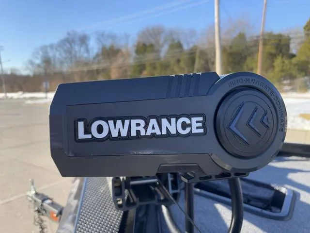 Slide: The Image of Lowrance device on 2023 Ranger RT188 boat, outdoor setting with trees in background. - 8