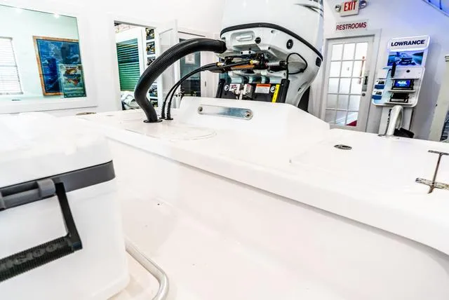 Slide: The Image of 2025 Majek 18 M2 boat interior with engine and equipment in showroom. - 12