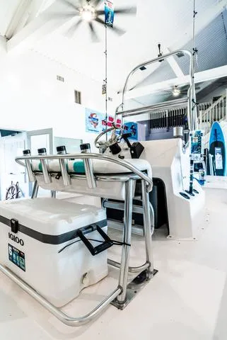 Slide: The Image of 2025 Majek 18 M2 boat interior with fishing gear and Igloo cooler. - 5